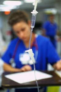 Nurse Behind Intravenous Tube